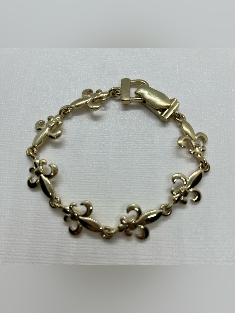 Gold tone Fleur-de-Lis Link Bracelet - Elegant Women's Jewelry